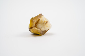 Close-up of the end of a peeled ripe banana with exposed creamy flesh.