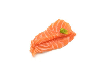 Sashimi made from salmon and wasabi on a white background. Japanese style food.