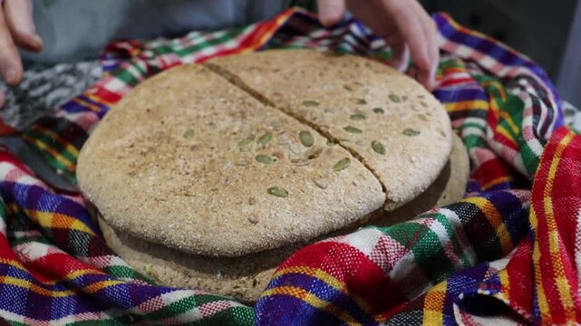 Traditional Moroccan seeded khobz &mdash; homemade round bread with anise, pumpkin and mixed seeds, rustic close-up video