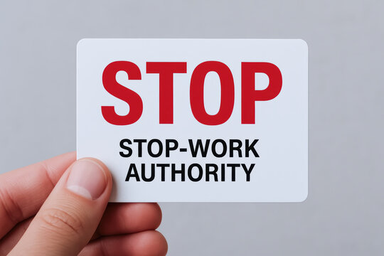 Stop work authority safety accident prevention card held by hand calm professional environment