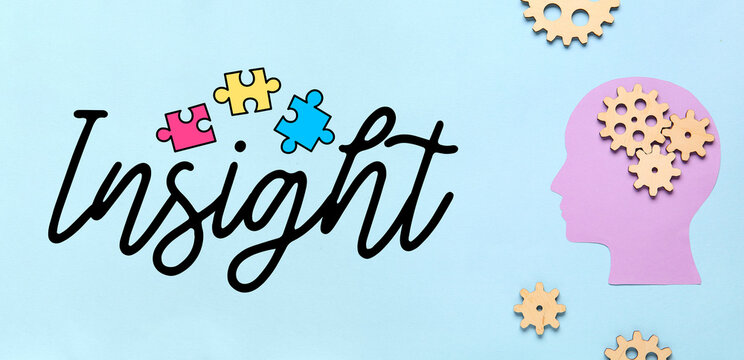 Paper human head with wooden gears on blue background. Logic concept