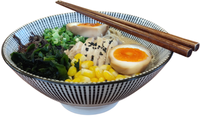 Ramen or Japanese noodles in a bowl with chopsticks, garnished with egg halves, chopsticks. corn kernels, seaweed and black sesame seeds  