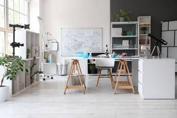 Table and shelving units in interior of medical laboratory