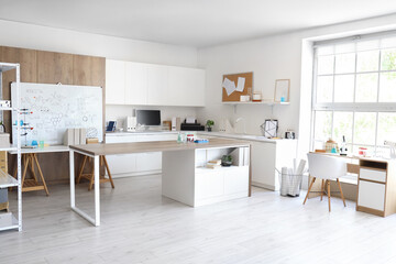 Interior of light medical laboratory with tables and houseplants