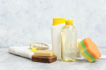 Pacifier and different bath accessories for children on grunge background