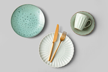 Set of clean dishes on light background