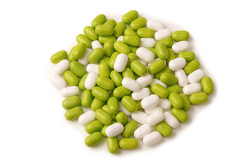 Sweet multicolored candies isolated on white background.