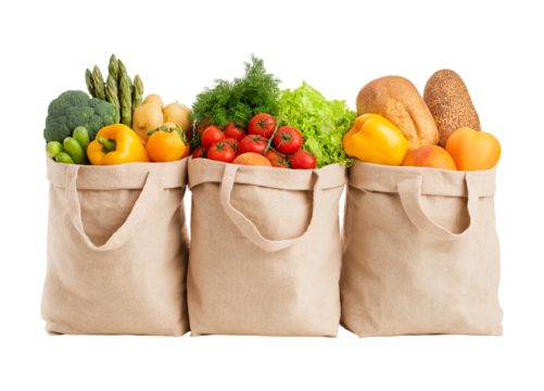 Assortment of fresh organic vegetables, fruits, and bread in eco-friendly shopping bags isolated on a transparent background