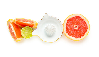 Ceramic juicer with grapefruit and lime isolated on white background, closeup