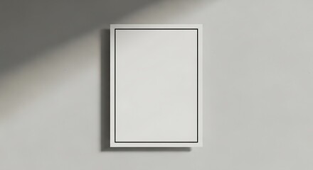 Minimalist blank frame on a light wall, casting shadows, ideal for showcasing artwork or photography