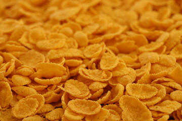 Corn flakes background and texture close up. Top view cornflake cereal box for morning breakfast
