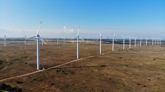 Aerial view of wind genertor park near Kaliakra cape. Green eco energy created electricity from nature.	
