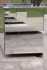mirrored rectangular flowered in modern stylish park making reflection effect