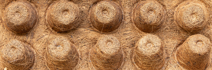 Background texture of coconut fiber seed tray, real organic material. Concept themes of gardening, organic planting, eco-friendly lifestyle, summer and spring season. Horizontal header or banner crop