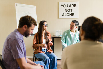 Hopeful people sharing experiences in support group