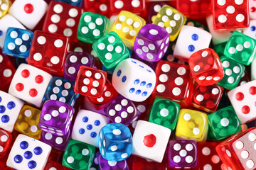 Different game dices as background, closeup
