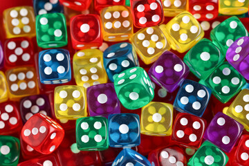 Different game dices as background, closeup