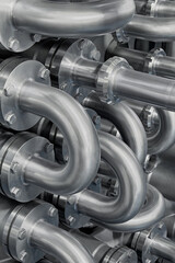 Curved stainless steel pipes, part of industrial cooling system