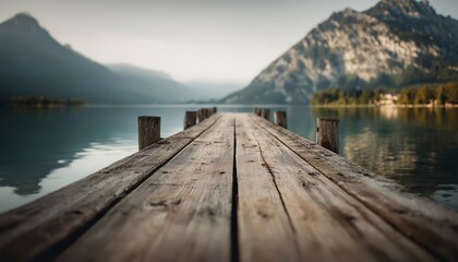 Fototapeta premium Wooden Pier Overlooking A Serene Lake With Majestic Mountains In The Background, Creating A Picturesque Scene In Nature'S Beauty.