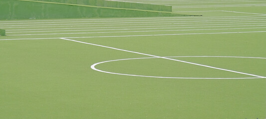 green artificial soccer field, minimal white lines