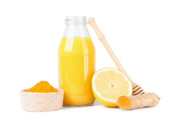 Bottle of healthy turmeric drink and ingredients isolated on white background, closeup