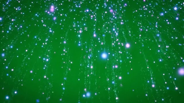 Gentle slow motion rain of luminous cosmic particles falling downward through an ethereal atmosphere on a green screen meditative, gentle slow motion, dust