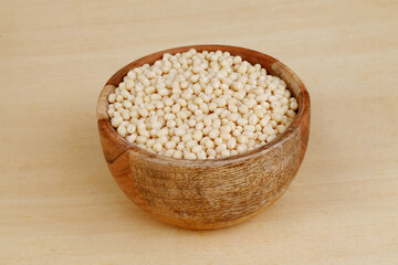 Urad dal or black gram in wooden bowl