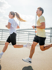 Running along the waterfront with friends enjoying a sunny day in the city