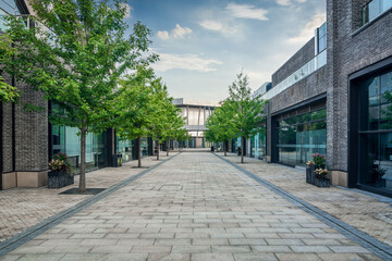 Serene Urban Pathway Surrounded by Lush Greenery and Contemporary Design