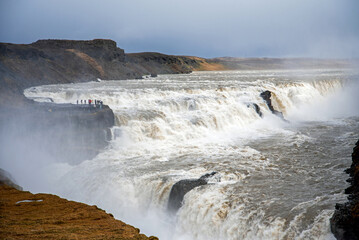 Tourists gateher at Gulfoss waterfall in Iceland.