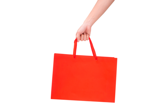 Hand holding empty red paper bag isolated on a transparent background.