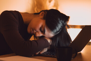 Tired teen girl caucasian university student fall asleep exhausted after difficult learn exam test, deprived lazy young woman sleeping sit at desk feel fatigue having nap dozing bored of study night