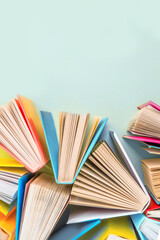 Background of books with copy space. Many colorful books. Concept of school library, children's literature, textbooks for teenagers.