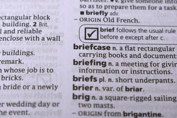 English Definition Dictionary Page Close Up Of Printed Word Of -Briefcase
