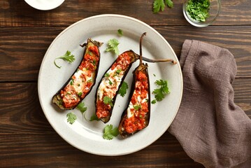 Oven baked aubergine with yogurt and tomato sauce dressing