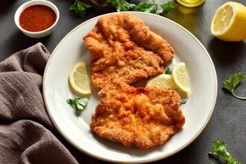 Schnitzel with served with lemon and parsley