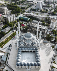 High-angle aerial view of the main central mosque complex with surrounding city buildings and streets in Bishkek