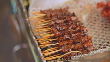 Shiny beef skewers, skewers glistening with marinade, beef skewers sparkle with glazed marinade shine, glazed marinade makes beef skewers gleam beautifully and appetizingly like delicious kebabs