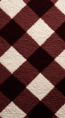 Close-up showing a diamond-shaped pattern in shades of maroon and white. The texture has a soft, carpet-like feel, creating a cozy and textured image with a visually engaging pattern.