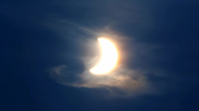 A partial solar eclipse forms a crescent sun, revealing its unique shape through a cinematic telephoto lens fantasy, timelapse, science