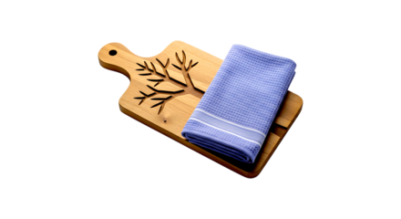 Rustic wooden cutting board with decorative tree etching and folded blue linen kitchen towel isolated on transparent background