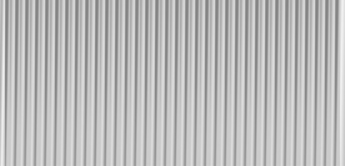 White ribbed glass texture background with soft frosted grey waves. A fluted, airy vector design featuring embossed stripes and minimal elegance—perfect for acrylic or polycarbonate surface visuals. © Bochana