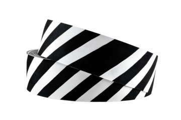 Safety caution tape with black and white diagonal stripes for warning signs