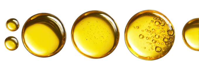 Golden liquid in circular dishes, showing bubbles
