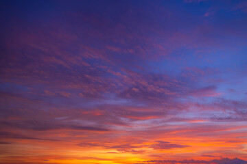 Obraz premium Twilight sky at sunrise and sunset,Sky at sunrise. Sunset background. Sunrise through clouds on sky. Twilight sky with sunrise colors. Peaceful dawn with soft light. Dramatic dusk sunrise with clouds.