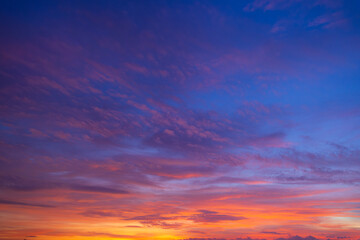 Twilight sky at sunrise and sunset,Sky at sunrise. Sunset background. Sunrise through clouds on sky. Twilight sky with sunrise colors. Peaceful dawn with soft light. Dramatic dusk sunrise with clouds.