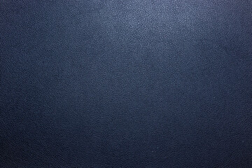 A close-up view of dark textured leather surface suitable for upholstery, fashion, or product design. This versatile background offers a classic aesthetic for various styles.