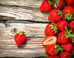 Fresh strawberries on rustic wooden planks