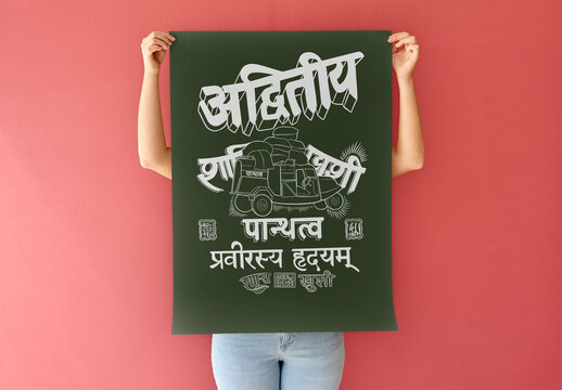 Mockup of woman holding a blank A2 poster against a red wall