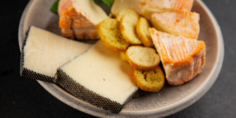 Cheese plate different kind of cheese appetizer tasty snack fresh delicious gourmet food background on the table rustic top view copy space